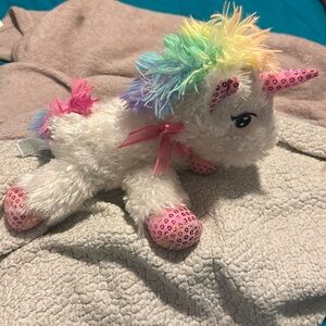 Little girls unicorn she’s white with pink and glittery feet with a pink bow
